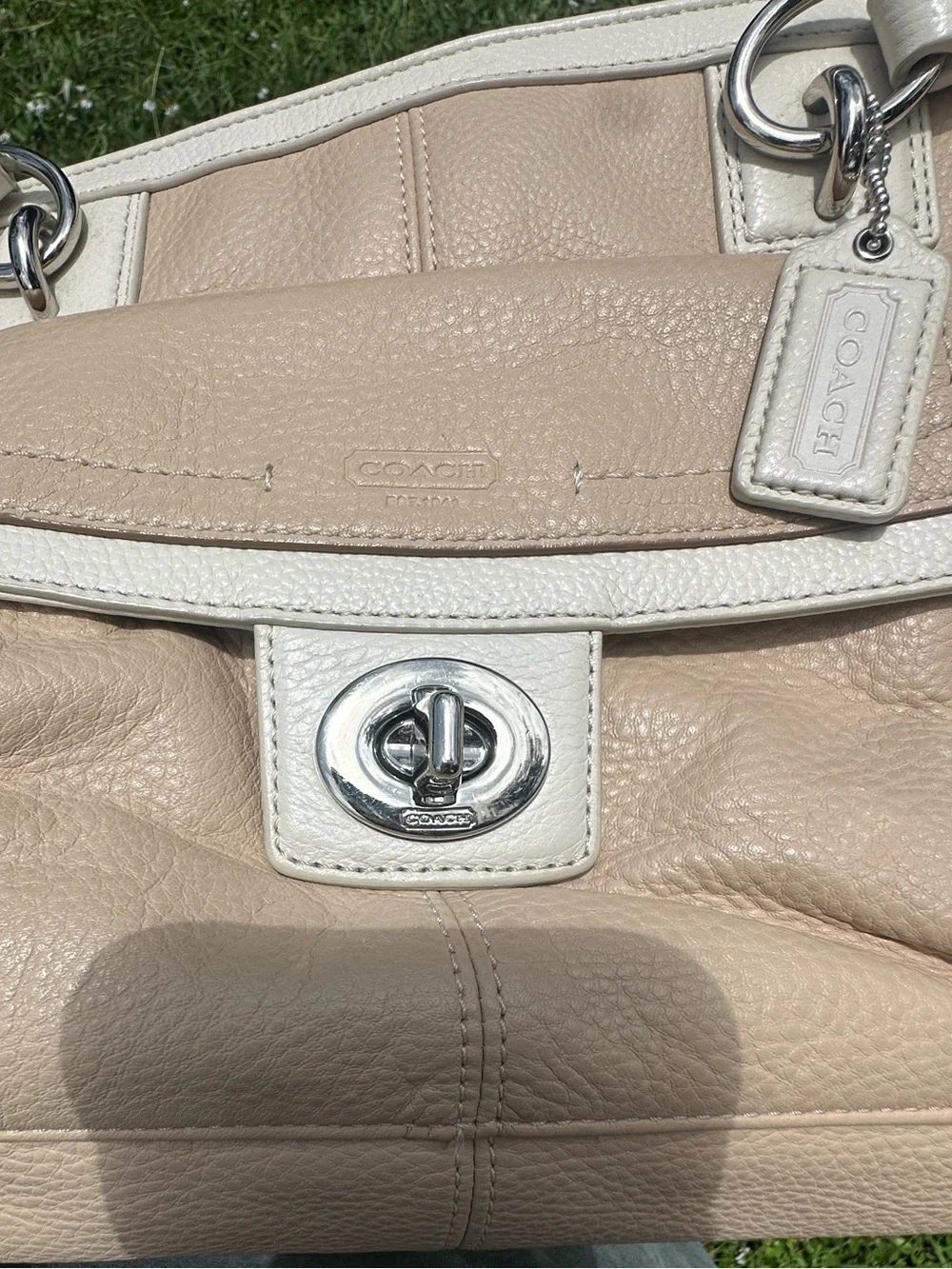 Coach Penelope pebbled leather purse in tan and cream w/ turn lock front pocket